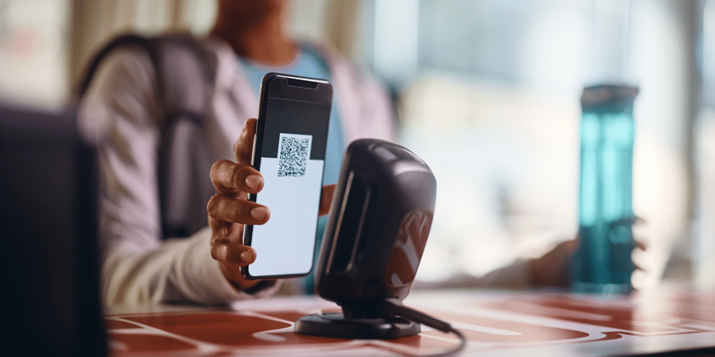 Gym member checking in with QR code