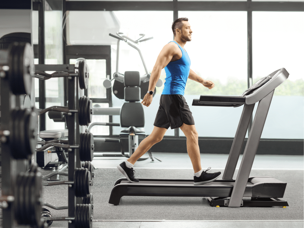 Clubwise | Man at gym walking on treadmill